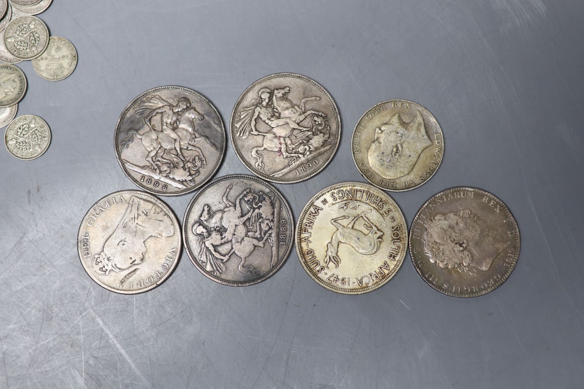 A collection of UK and world coins including George IV - George V silver threepences to halfcrowns